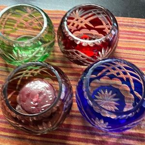 Cut glass small candle holders.  4 different colors.